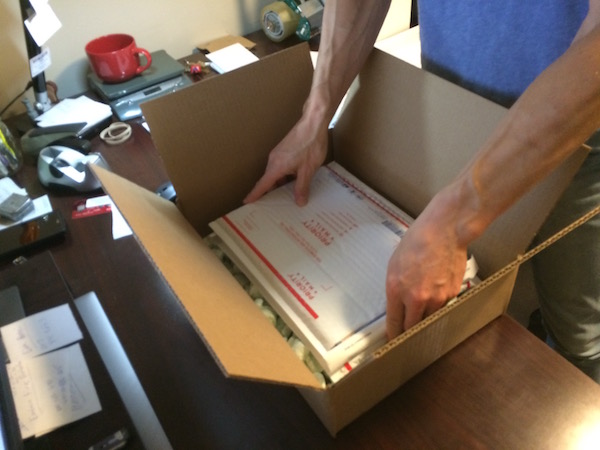 Shipping CGC comics: lay the books on top of the layer of padding