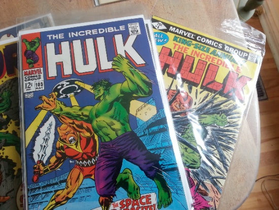 Stack Annuals and over-size special editions at the bottom of the same hero's stack.