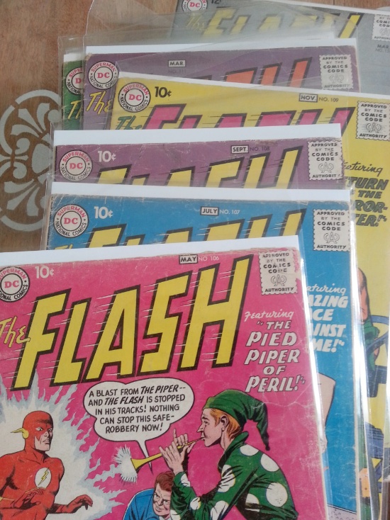 Here's a pile of The Flash, sorted by issue # in order, with the lowest on top and the highest at the bottom.